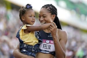 Alyson Felix with her child, personal branding was as successful as her 11 Olympic medals, as told by Joanne Z. Tan for blog about be your own brand