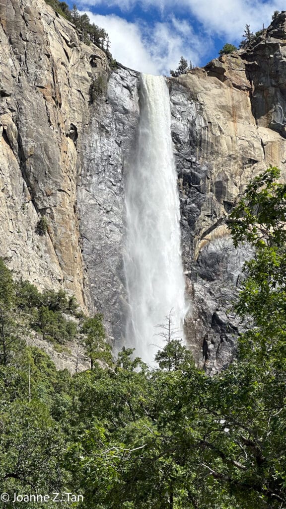 A waterfall in Yosemite Valley, brings white clouds down. By Joanne Z. Tan, global brand strategist & branding expert, writer, award-winning photographer, poet.