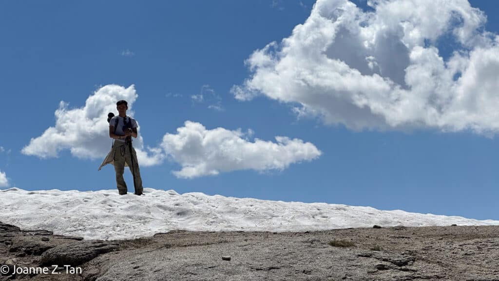 On the way to Clouds Rest, Daley stood on snow with clouds, by Joanne Z. Tan, writer, award-winning photographer & poet, top brand strategist & branding expert.