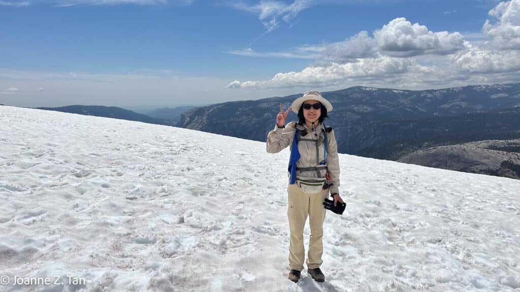 Standing on snow atop Half Dome, Yosemite adventure stories by Joanne Z. Tan, top brand strategist, branding expert, writer, award-winning photographer & poet.