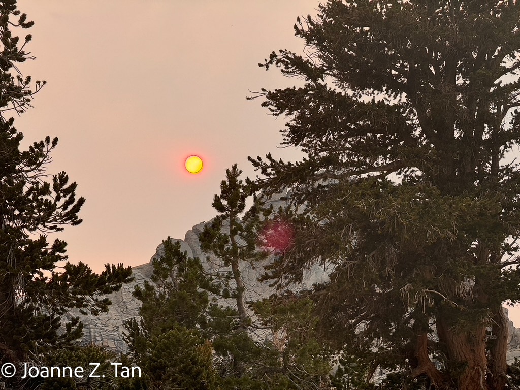 Setting Sun shrouded by smokes in the air from wild fires on the High Sierra, a true adventure stories by Joanne Z. Tan, Pt 1 of 3, about backpacking and hiking