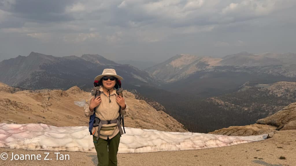 Joanne Z. Tan on top of a mountain in the High Sierra, a true adventure story, Pt 1 of 3, about backpacking and hiking.