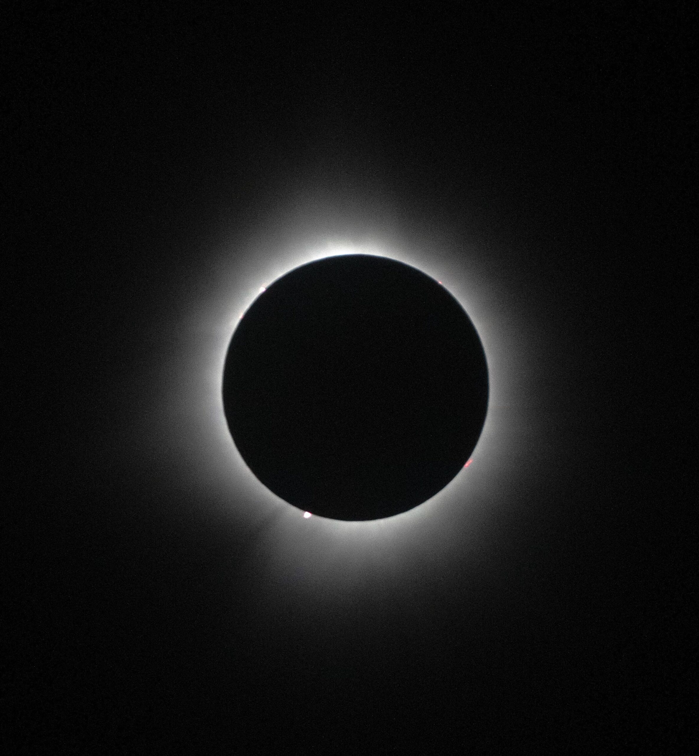 A short poem by Joanne Z. Tan: "From a Pinhole into a Multiverse", portrays a religion as a pinhole to God, to a solar eclipse, to the universe's way of life.