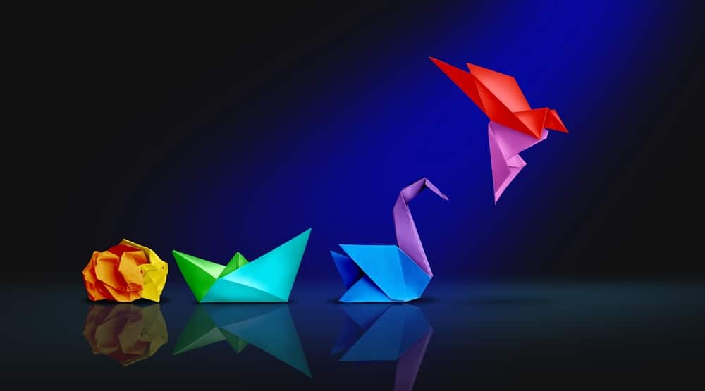 Brand positioning is when a company creates associations between the brand and its value proposition for target audience, per Joanne Z. Tan, brand strategist. (origami birds)